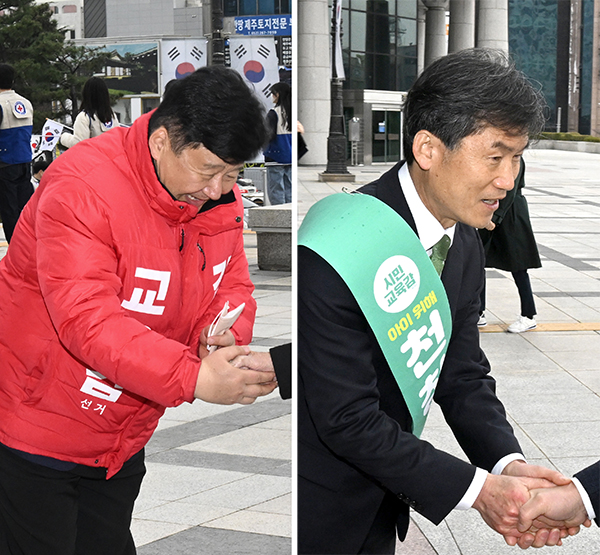 1일 울산시교육감 보궐선거에 출마한 김주홍 예비후보(왼쪽)와 천창수 예비후보가 3·1절 기념행사가 열린 울산문화예술회관 입구에서 시민들과 악수하고 있다. 김경우기자